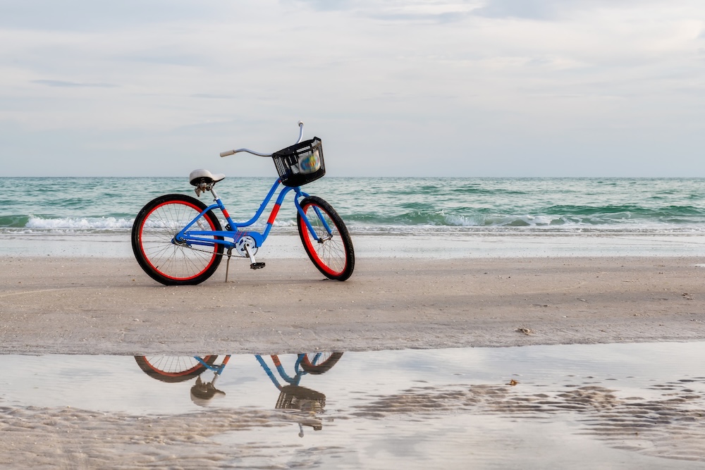 Bicycle on the beach at Sunset.