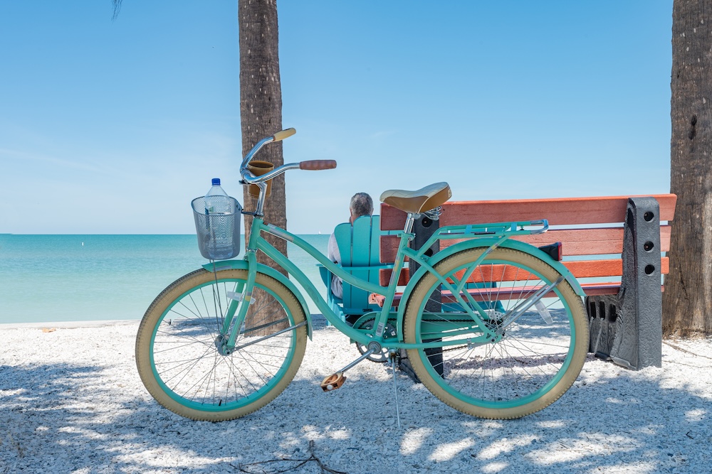 Bike and bench at the beach.