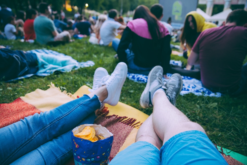 People watching movie in open air cinema.